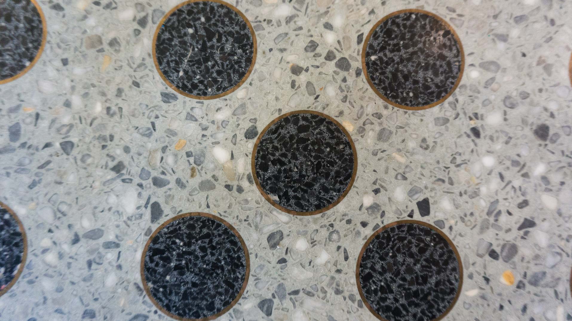 black terrazzo in brass circles