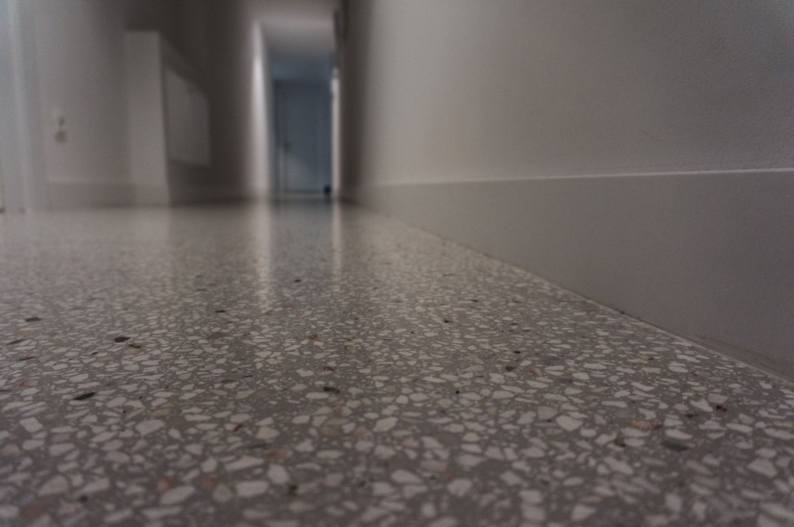 grey terrazzo flooring in hallways