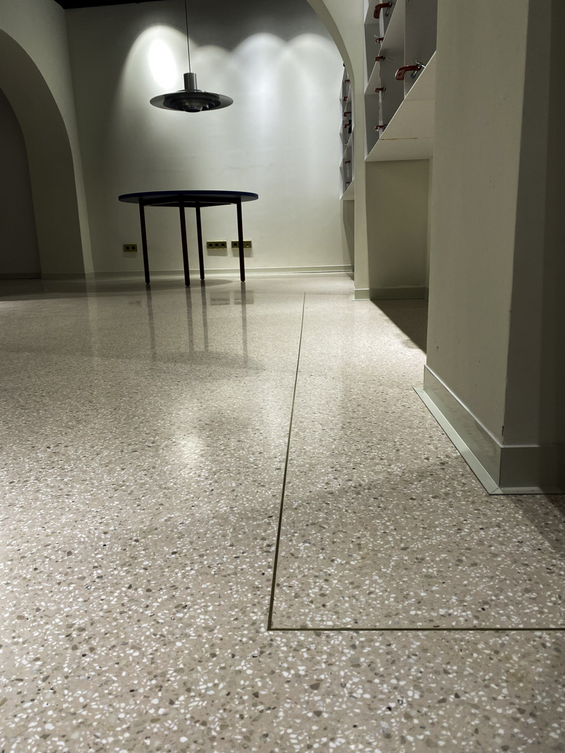 pink terrazzo flooring and brass detail